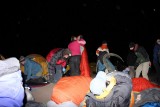 Setting up mattresses and sleeping bags outside to attend the night sky lecture
